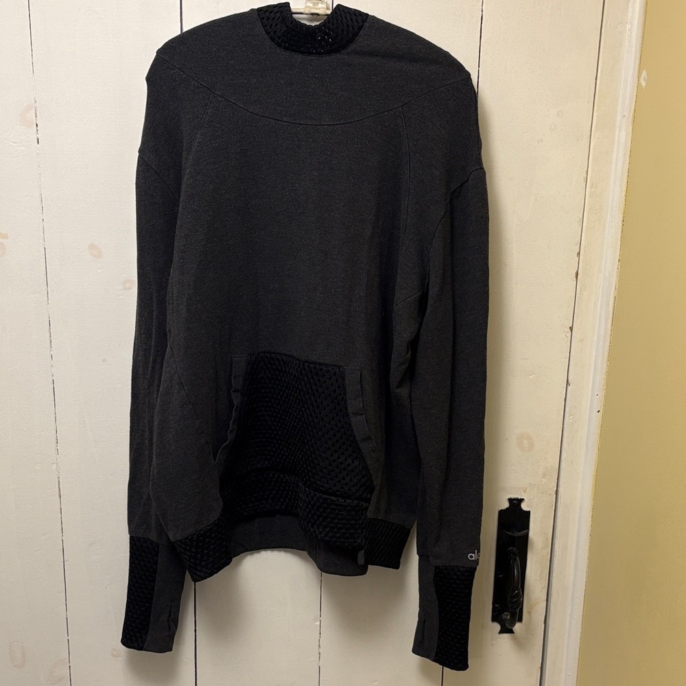 ALO Yoga Woman’s Hoodie gray with black mesh accents.